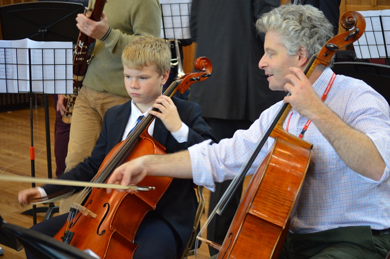 Cellist from LCO working with pupil